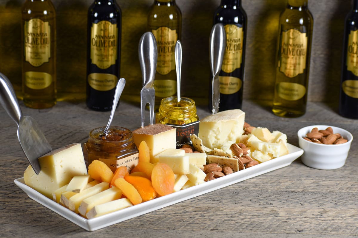 A cheese board with our cheeses, preserves and dried fruit